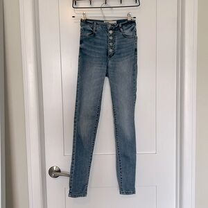 Ultra high rise light wash skinny jeans